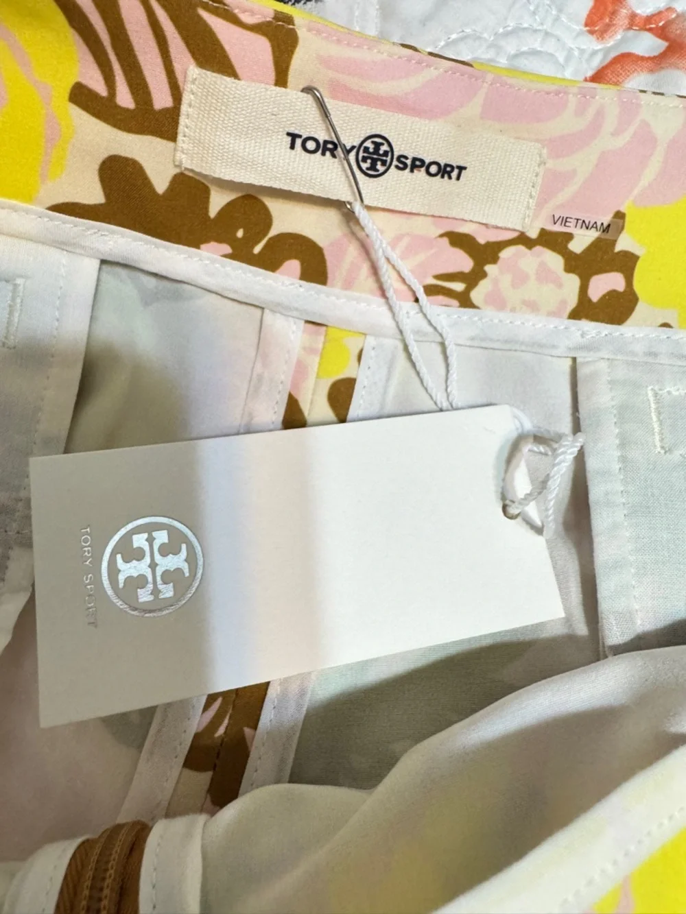 Tory Burch Tory Sport Printed Ruffle Golf Skort in French Crème Bouquet Pink